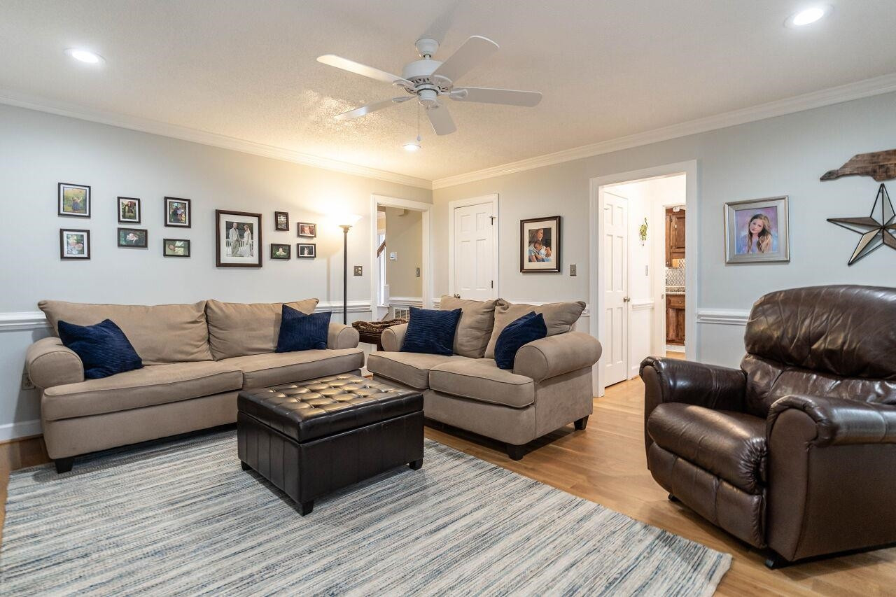 5924 Clearsprings Drive Wake Forest, NC 27587 - Photo 12 of 37 a living room with furniture and a wooden floor