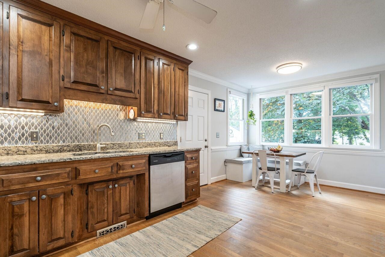 5924 Clearsprings Drive Wake Forest, NC 27587 - Photo 15 of 37 a kitchen with a sink stove and cabinets