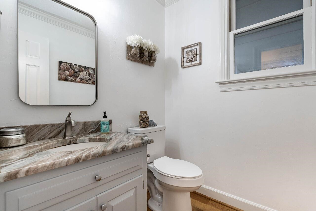 5924 Clearsprings Drive Wake Forest, NC 27587 - Photo 17 of 37 a bathroom with a granite countertop sink mirror and toilet