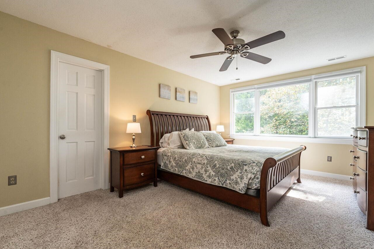 5924 Clearsprings Drive Wake Forest, NC 27587 - Photo 18 of 37 a bedroom with a bed and window