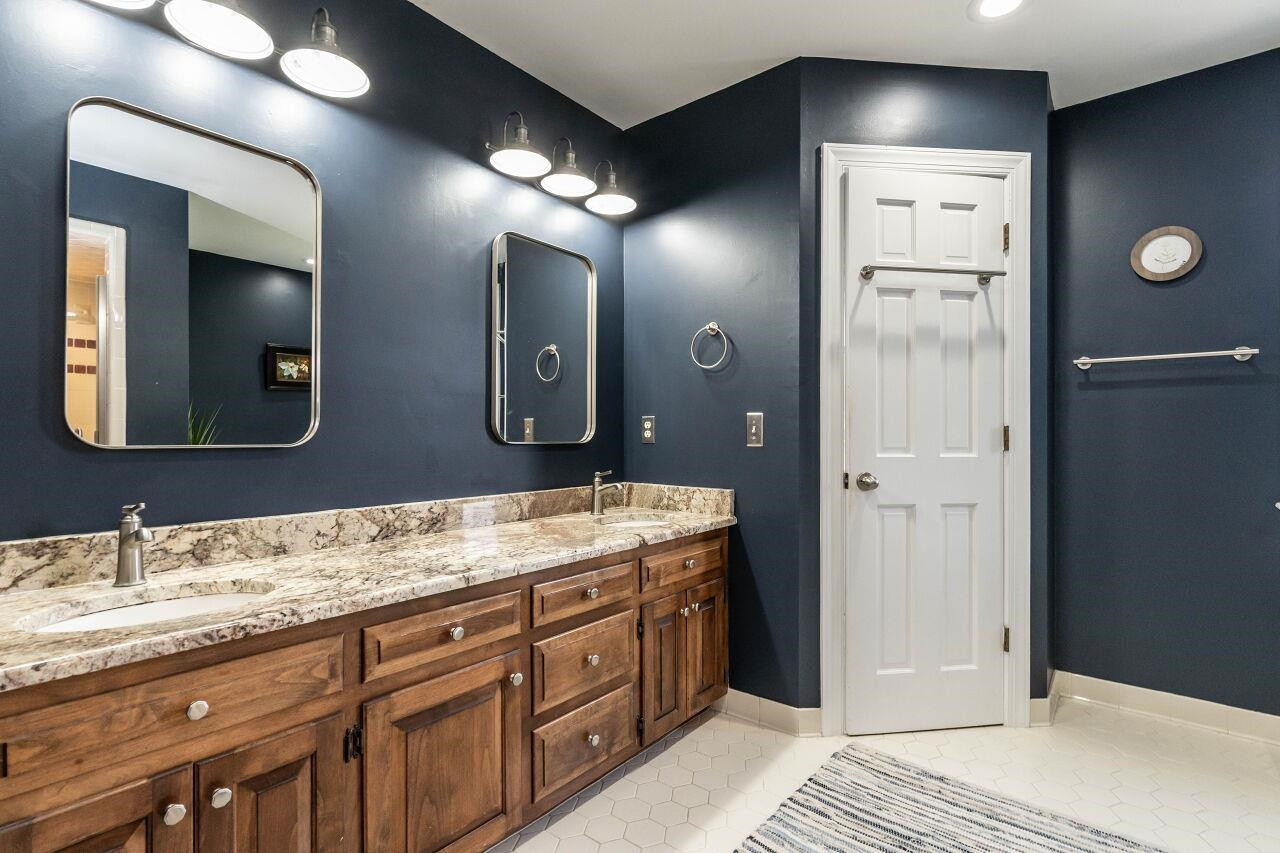 5924 Clearsprings Drive Wake Forest, NC 27587 - Photo 20 of 37 a spacious bathroom with a double vanity sink and a mirror