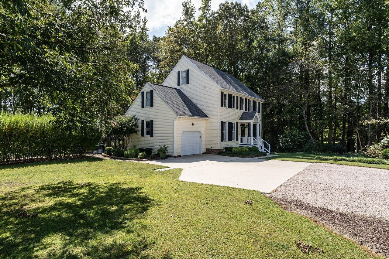 5924 Clearsprings Drive Wake Forest, NC 27587 - Photo 2 of 37 a front view of a house with yard and green space