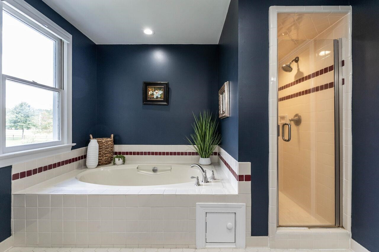 5924 Clearsprings Drive Wake Forest, NC 27587 - Photo 21 of 37 a bathroom with a bathtub and a sink