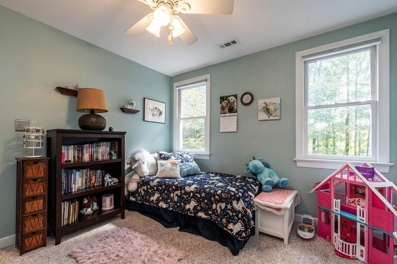 5924 Clearsprings Drive Wake Forest, NC 27587 - Photo 22 of 37 a bedroom with bed and a window
