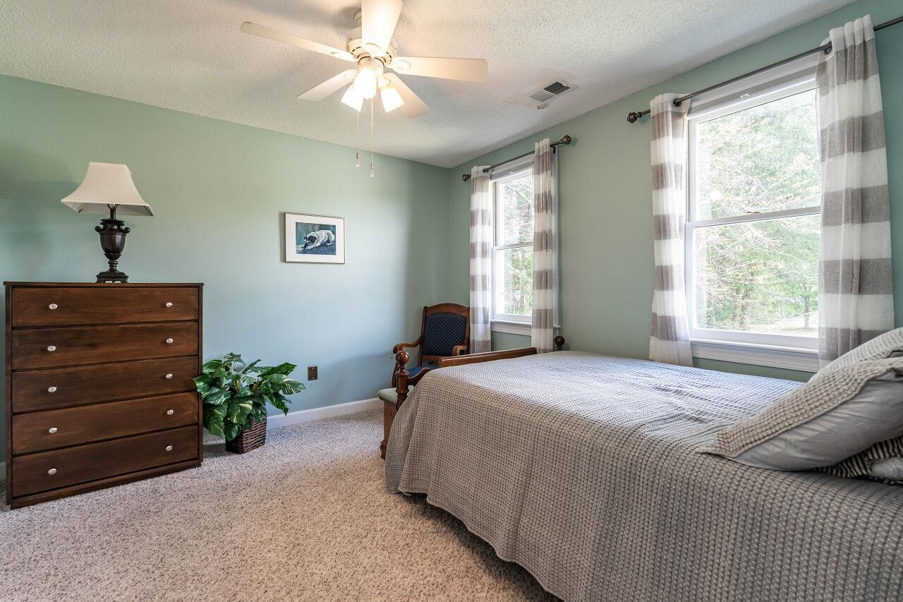 5924 Clearsprings Drive Wake Forest, NC 27587 - Photo 25 of 37 a bedroom with a bed and a dresser
