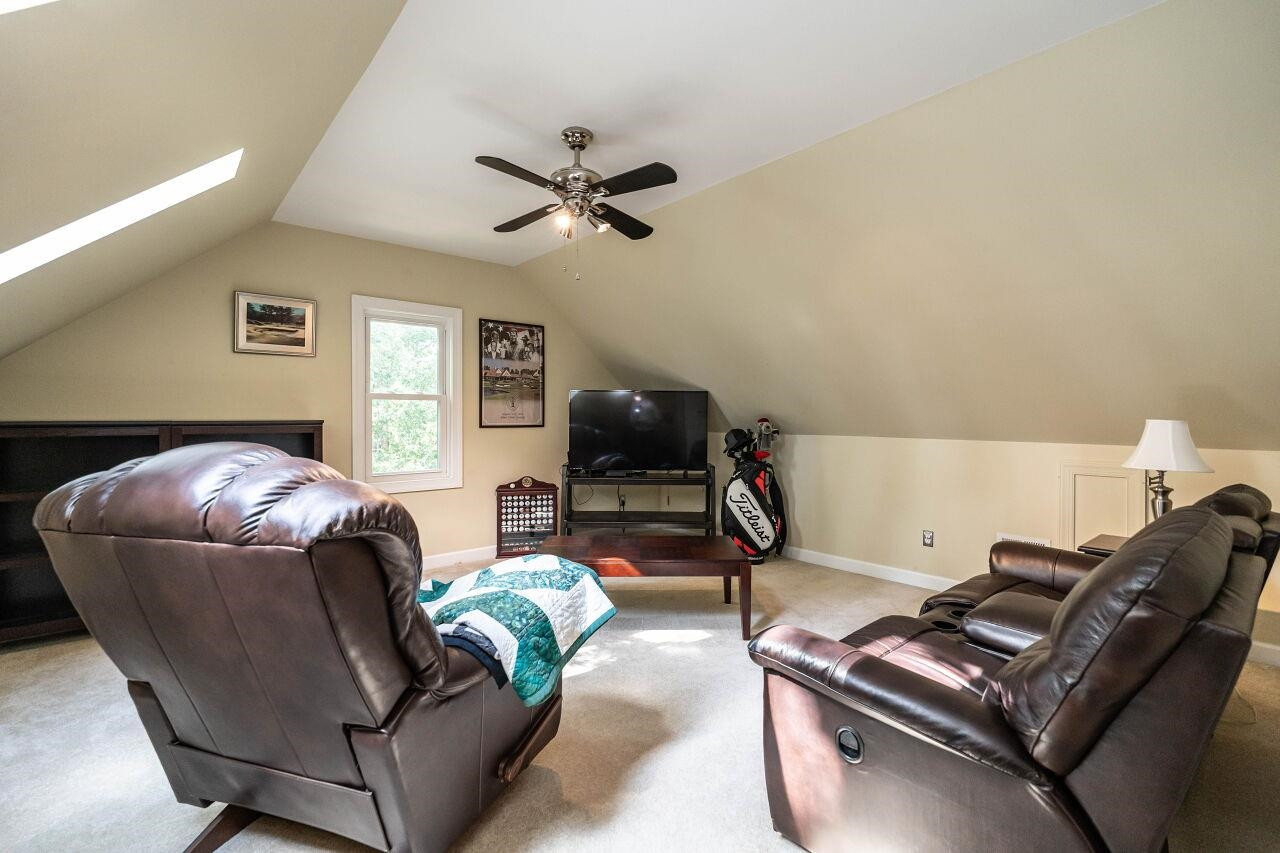 5924 Clearsprings Drive Wake Forest, NC 27587 - Photo 26 of 37 a living room with furniture and a wooden floor