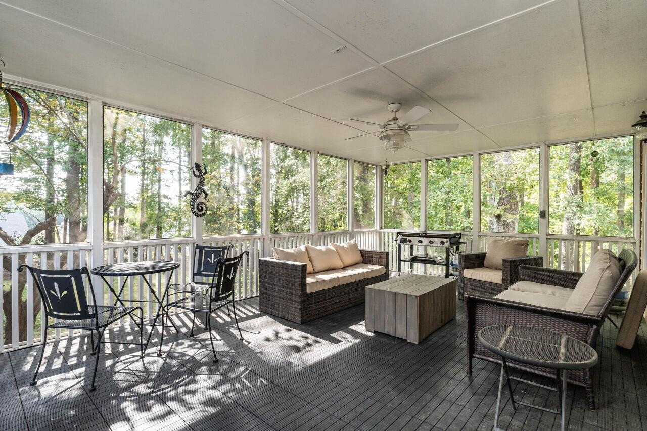 5924 Clearsprings Drive Wake Forest, NC 27587 - Photo 28 of 37 a living room with furniture and a large window