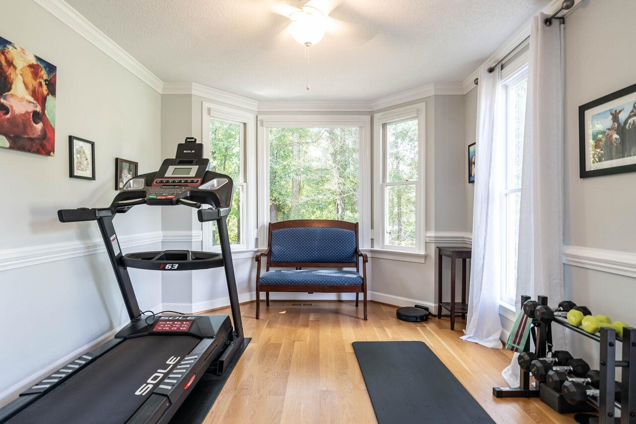 5924 Clearsprings Drive Wake Forest, NC 27587 - Photo 6 of 37 a living room with furniture and a flat screen tv