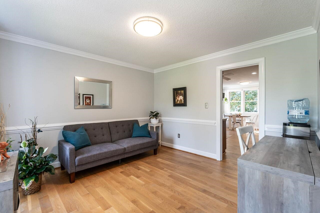5924 Clearsprings Drive Wake Forest, NC 27587 - Photo 7 of 37 a living room with furniture and a wooden floor
