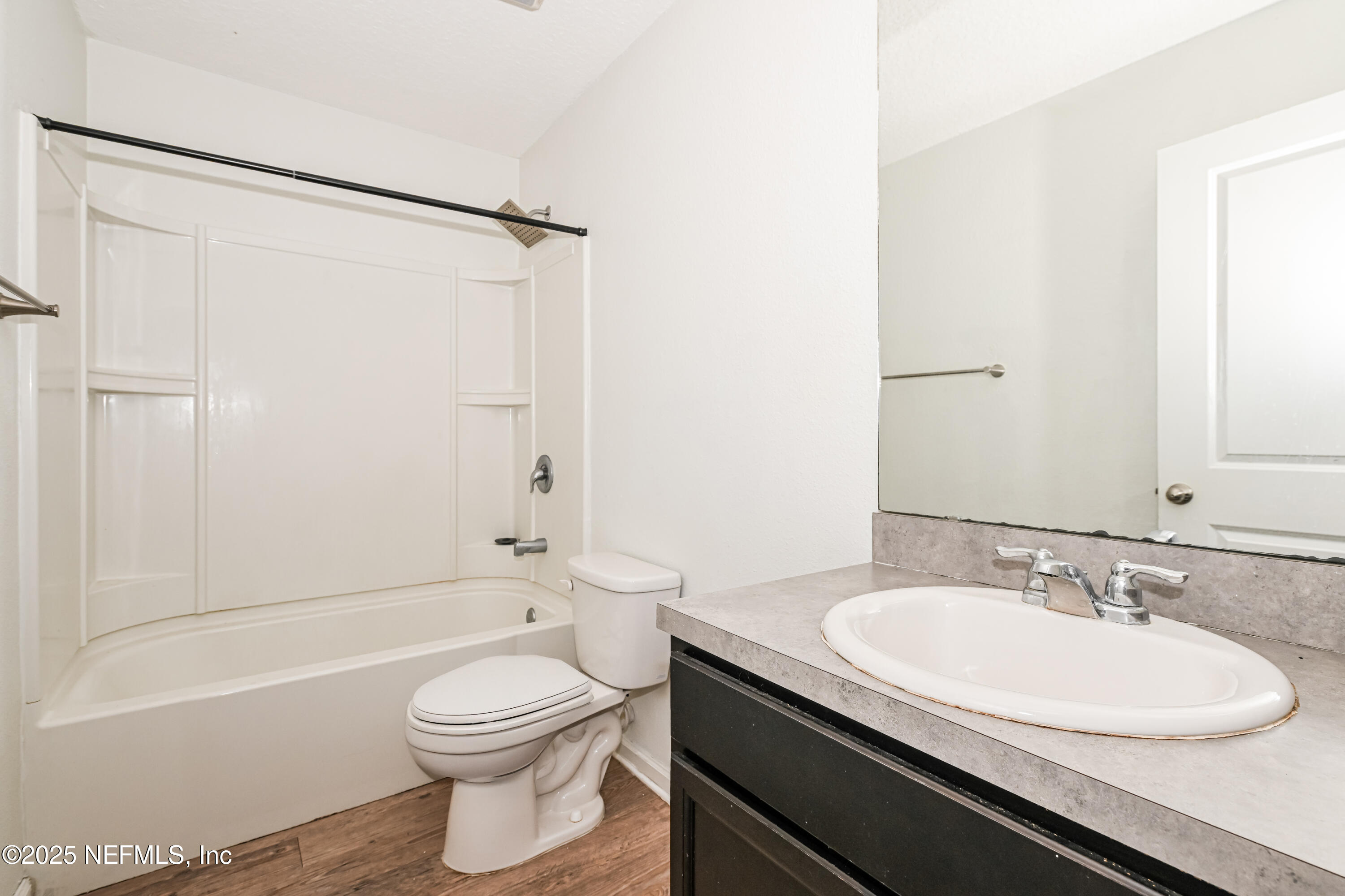 548 Eiseman Way Jacksonville, FL 32216 - Photo 10 of 15 a bathroom with a granite countertop sink toilet and shower