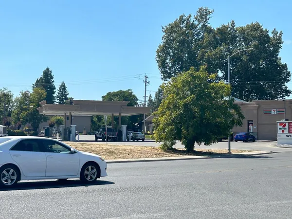 a view of the street with parked cars