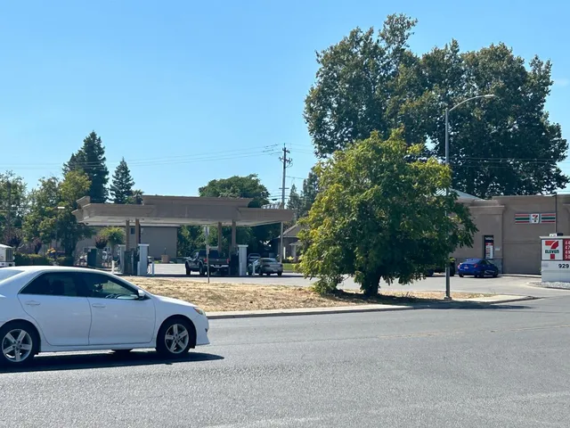 a view of the street with parked cars