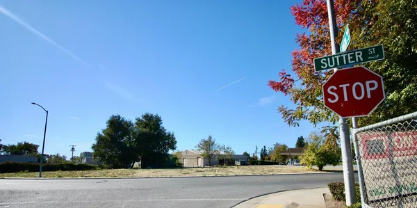 a view of a street with a building in the background