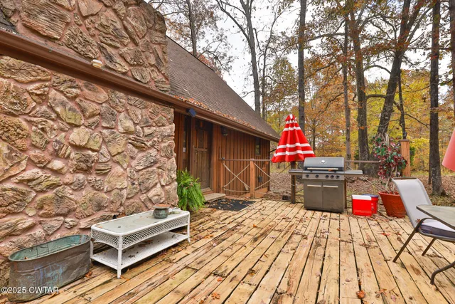 a view of a dining room with furniture chandelier and wooden floor