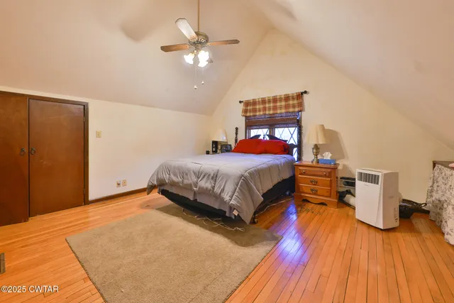 a house that has a tree in front of it