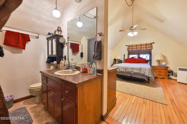 a backyard of a house with large trees