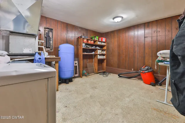 a kitchen with cabinets and wooden floor