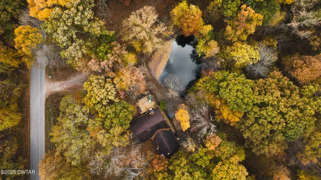 a view of a park with iron fence