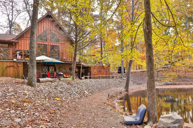 a view of swimming pool with outdoor seating