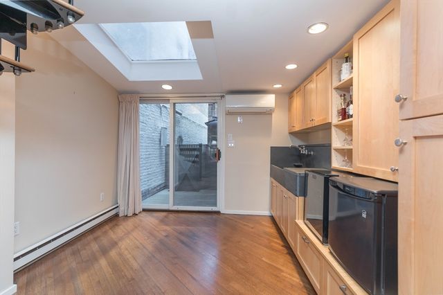 a view of a bench in the backyard