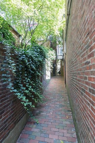 a view of balcony with wooden floor and fence
