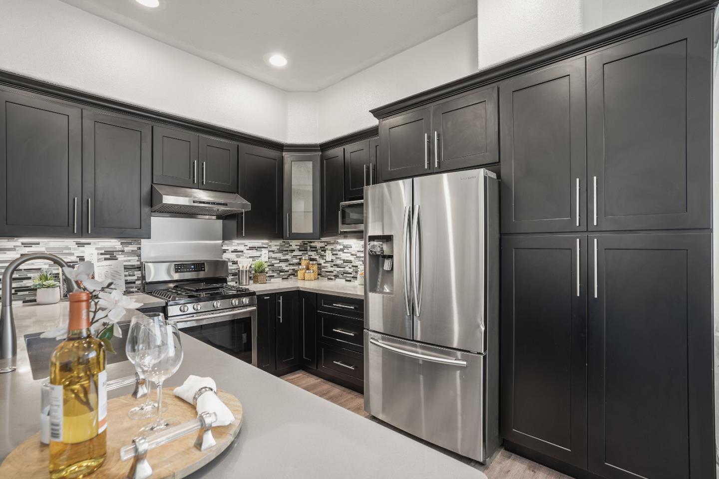 894 Fascination Place Milpitas, CA 95035 - Photo 11 of 30 a kitchen with stainless steel appliances granite countertop a refrigerator stove and sink