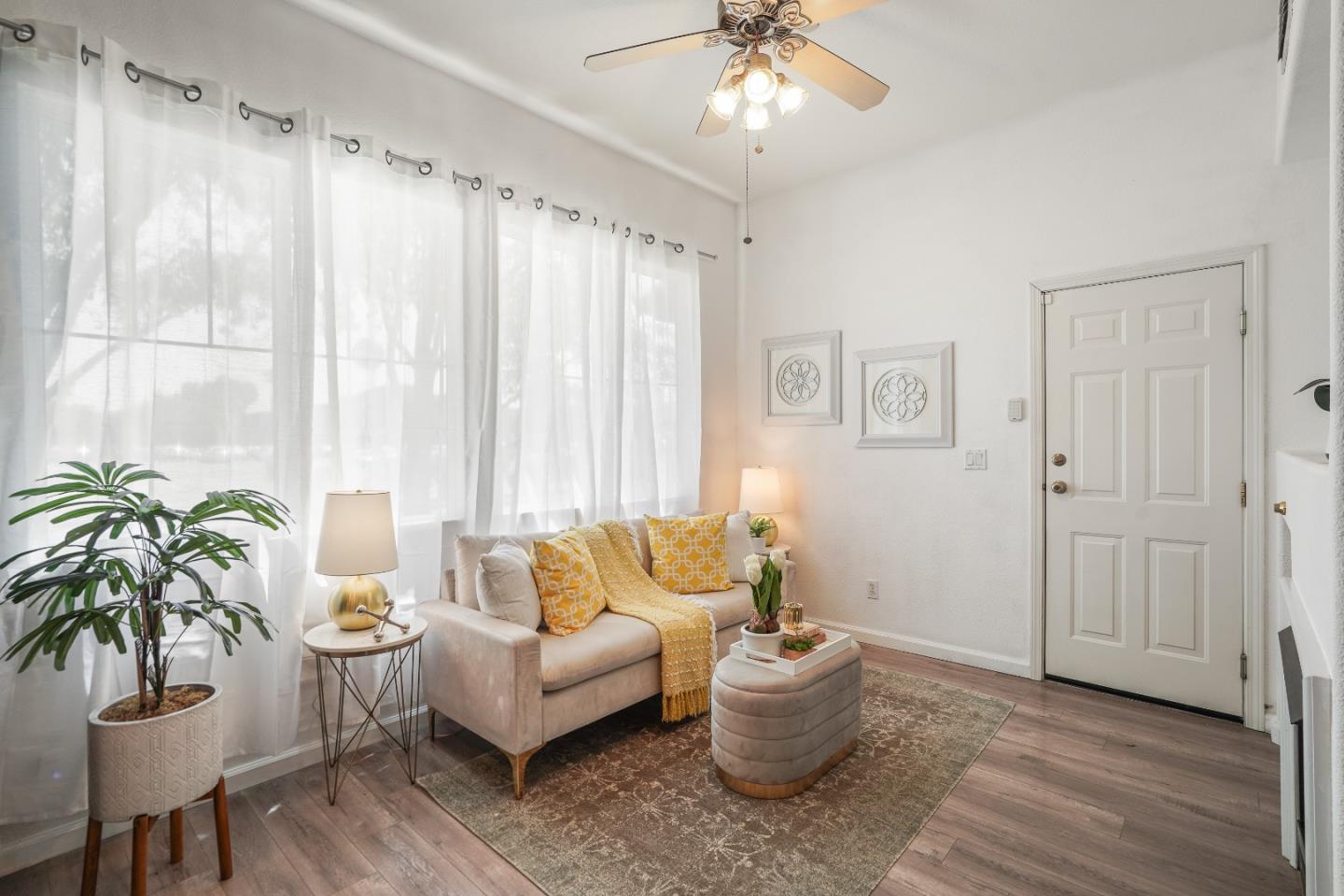 894 Fascination Place Milpitas, CA 95035 - Photo 12 of 30 a living room with furniture and a large window