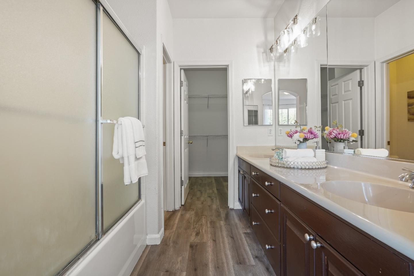 894 Fascination Place Milpitas, CA 95035 - Photo 16 of 30 a spacious bathroom with a granite countertop sink mirror and shower