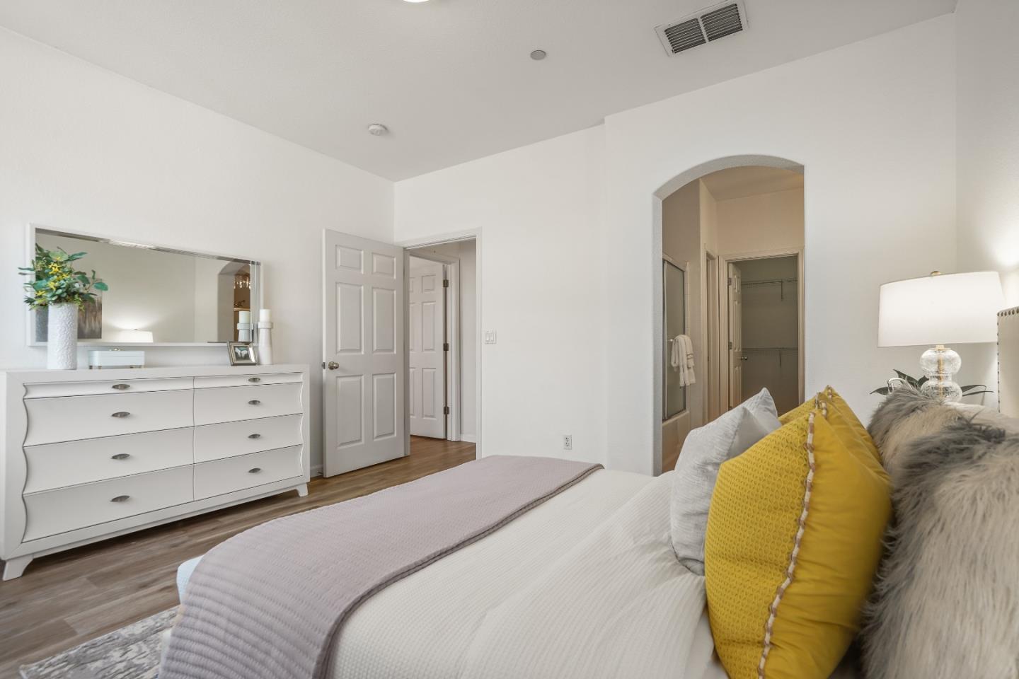 894 Fascination Place Milpitas, CA 95035 - Photo 17 of 30 a bedroom with a bed and a mirror