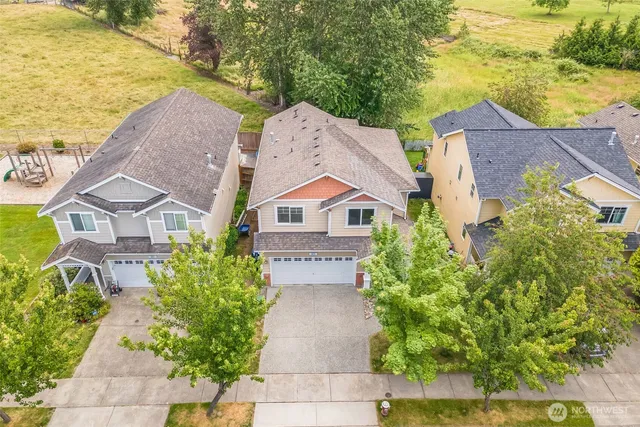 an aerial view of a house with a lake view