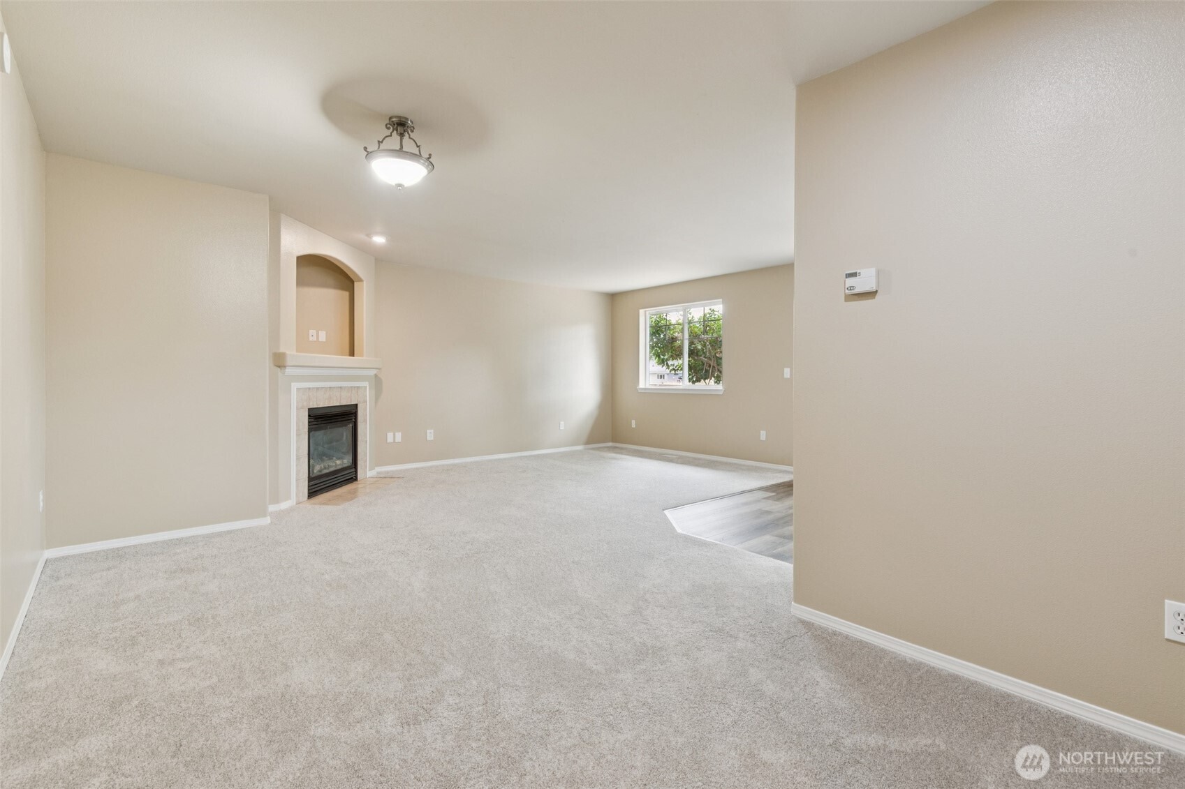 323 Helen Street Sedro-Woolley, WA 98284 - Photo 18 of 34 an empty room with windows and fireplace