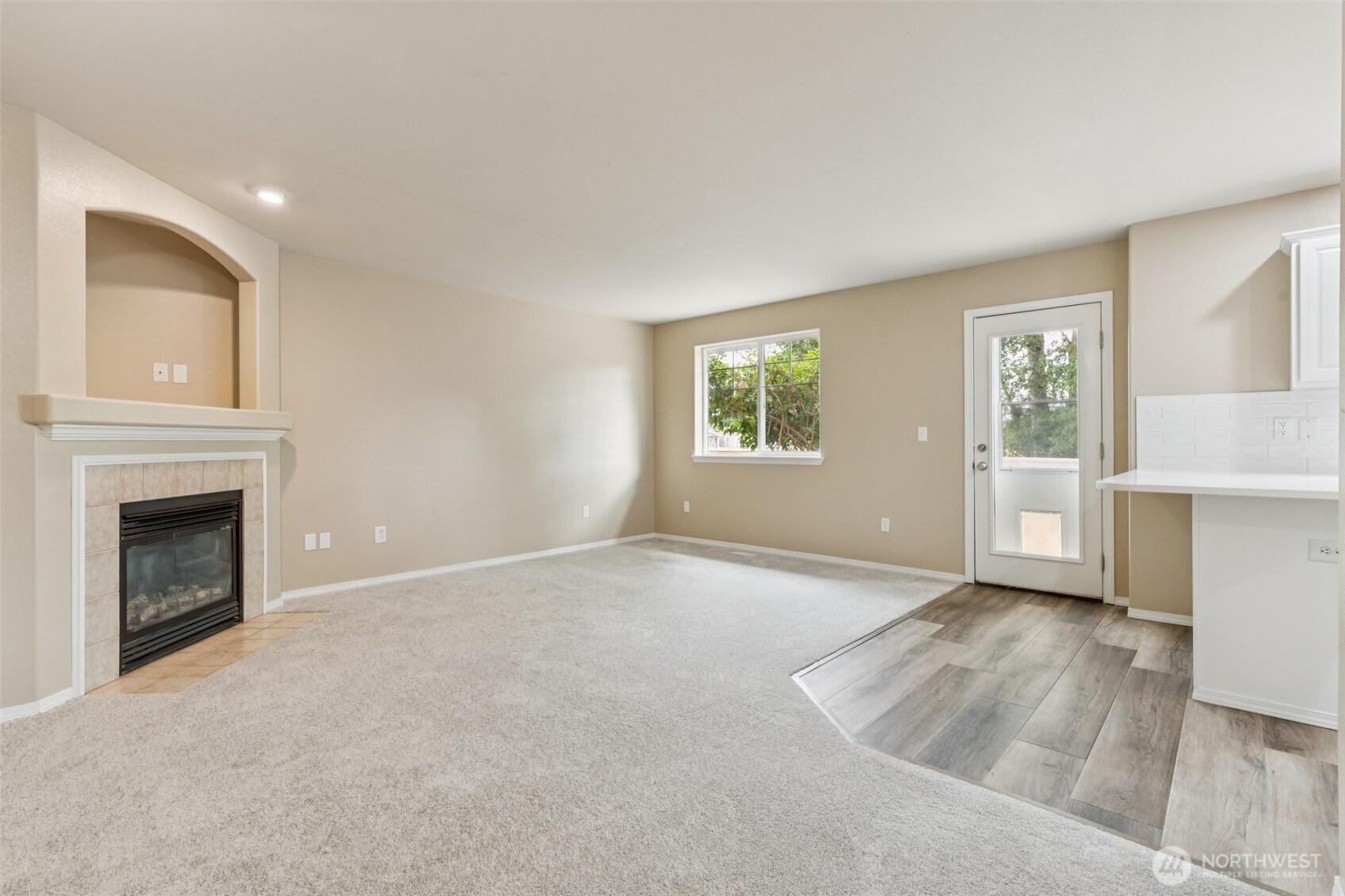323 Helen Street Sedro-Woolley, WA 98284 - Photo 8 of 34 an empty room with windows and fireplace