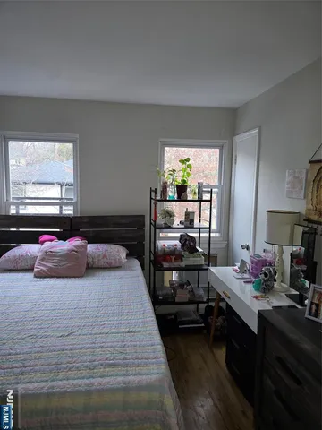 a bedroom with a bed furniture and window