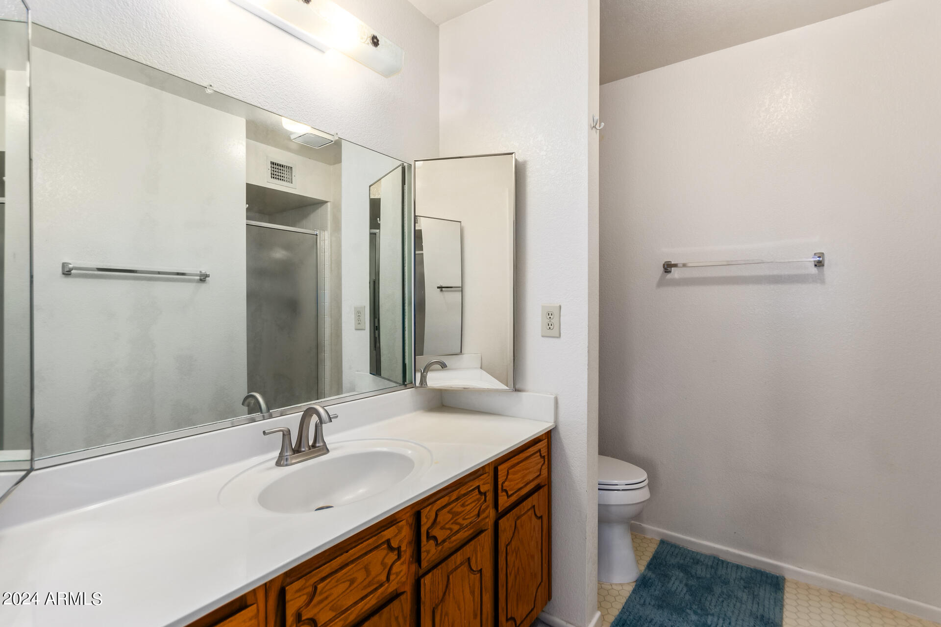 520 South Greenfield Road, Unit 39 Mesa, AZ 85206 - Photo 11 of 19 a bathroom with a sink a toilet and shower