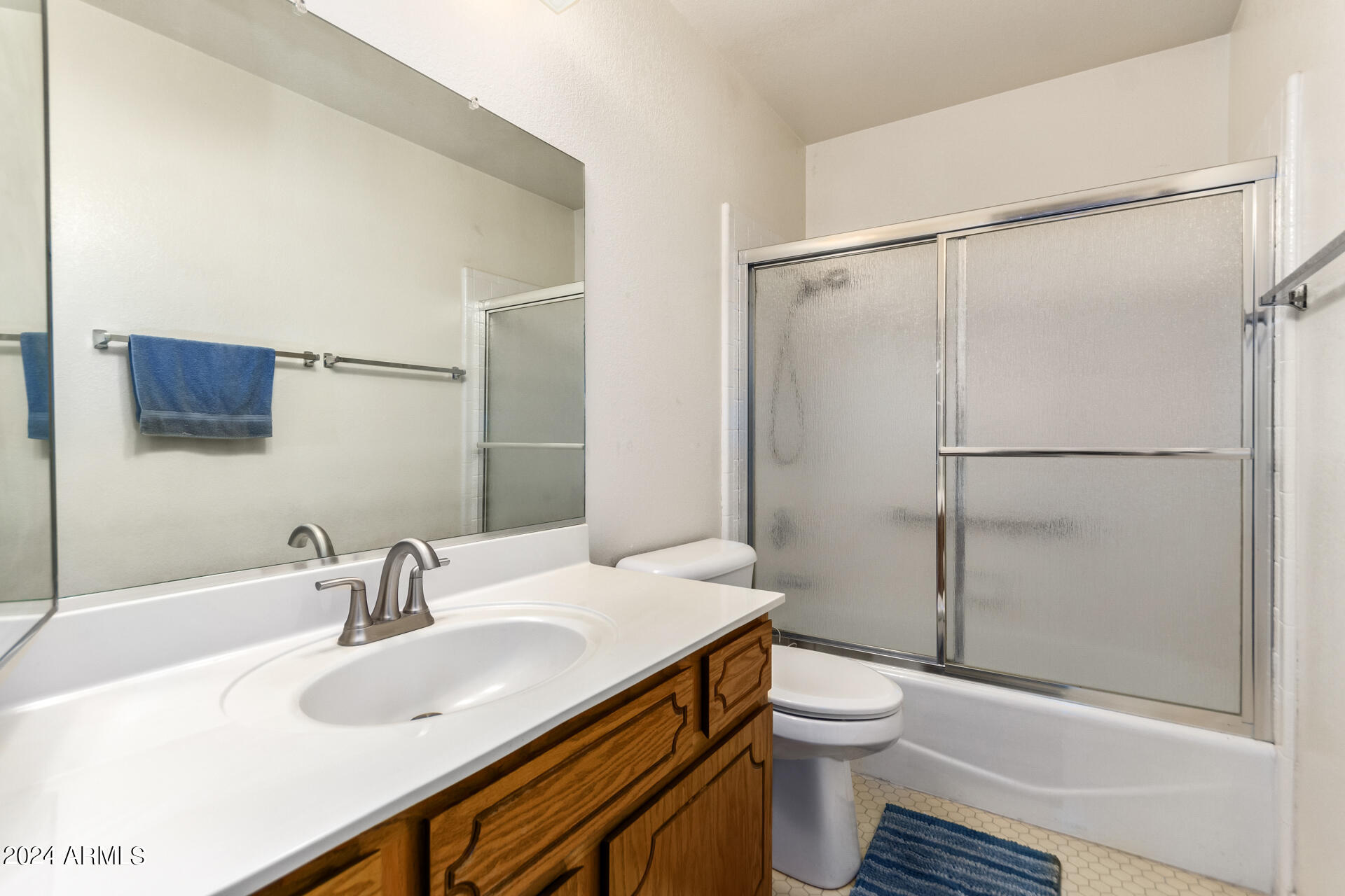 520 South Greenfield Road, Unit 39 Mesa, AZ 85206 - Photo 16 of 19 a bathroom with a sink toilet and shower