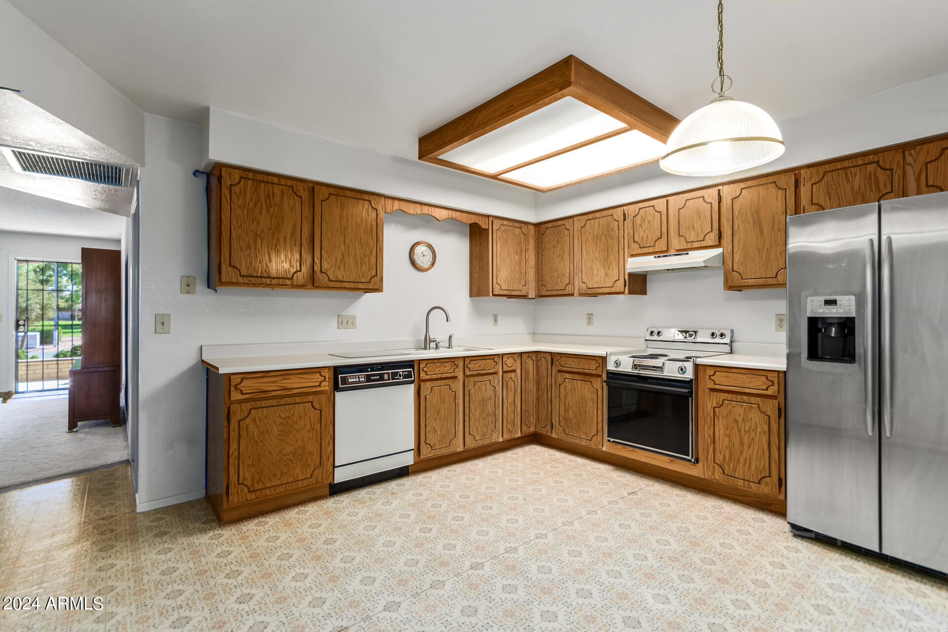 520 South Greenfield Road, Unit 39 Mesa, AZ 85206 - Photo 8 of 19 a kitchen with stainless steel appliances granite countertop a refrigerator a stove top oven a sink and dishwasher