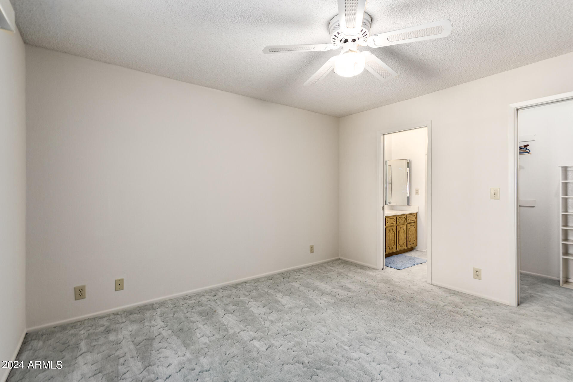 520 South Greenfield Road, Unit 39 Mesa, AZ 85206 - Photo 10 of 19 an empty room with fan and windows