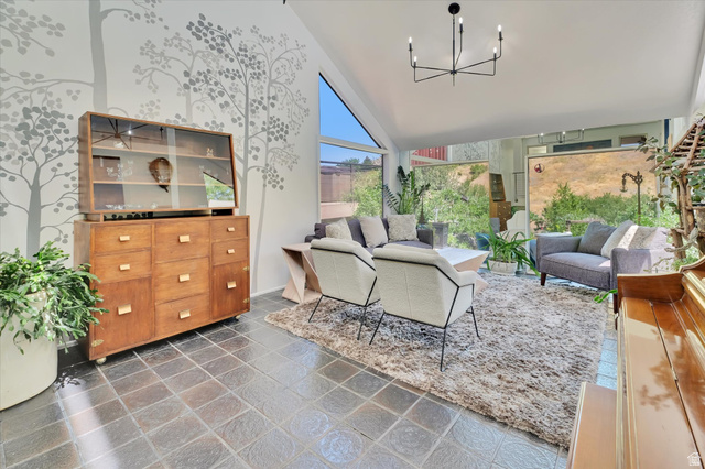 510 Spring Creek Road Providence, UT 84332 - Photo 7 of 97 Sun-filled interior space featuring high vaulted ceilings, large picture windows, and dark square tile flooring