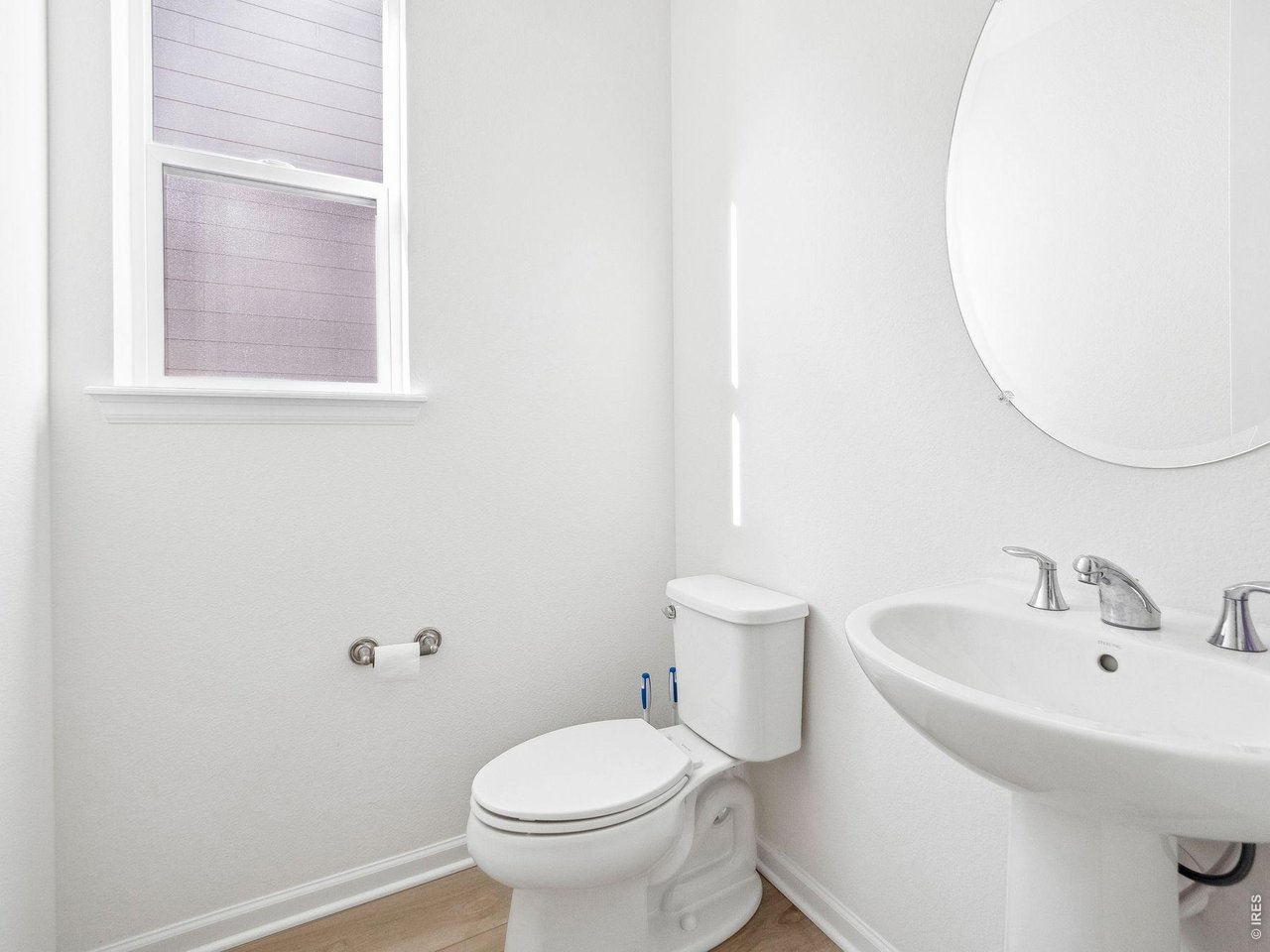 3051 Newfound Lk Road Berthoud, CO 80513 - Photo 21 of 36 a white toilet sitting next to a bathroom sink