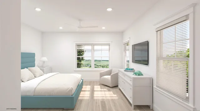 a bedroom with furniture and a flat screen tv