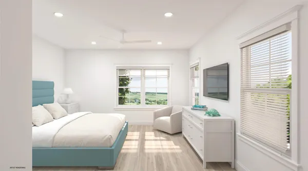 a bedroom with furniture and a flat screen tv