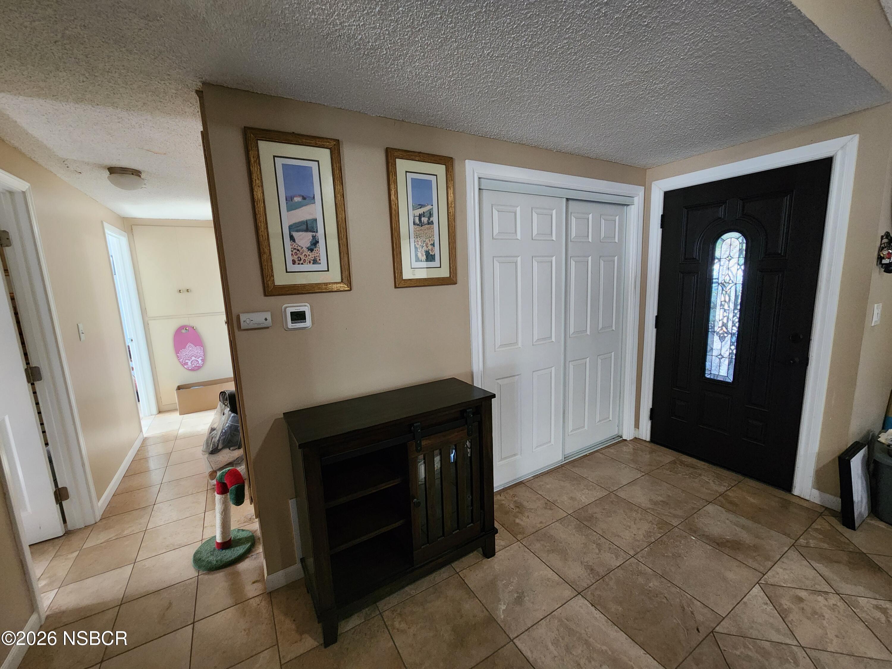 3770 Rucker Road Lompoc, CA 93436 - Photo 11 of 36 a bedroom with a bed and a mirror