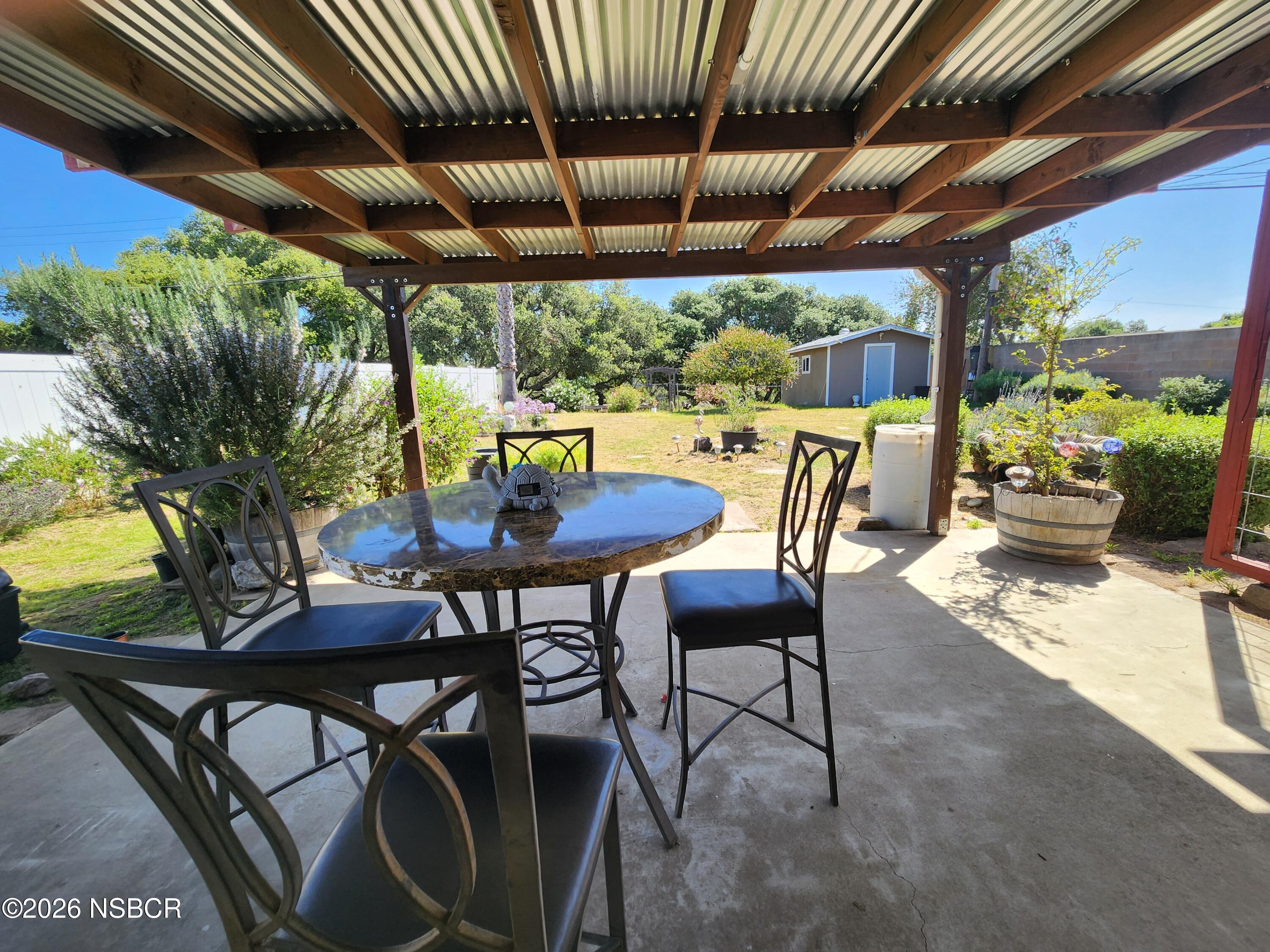3770 Rucker Road Lompoc, CA 93436 - Photo 24 of 36 a view of a patio with table and chairs and potted plants