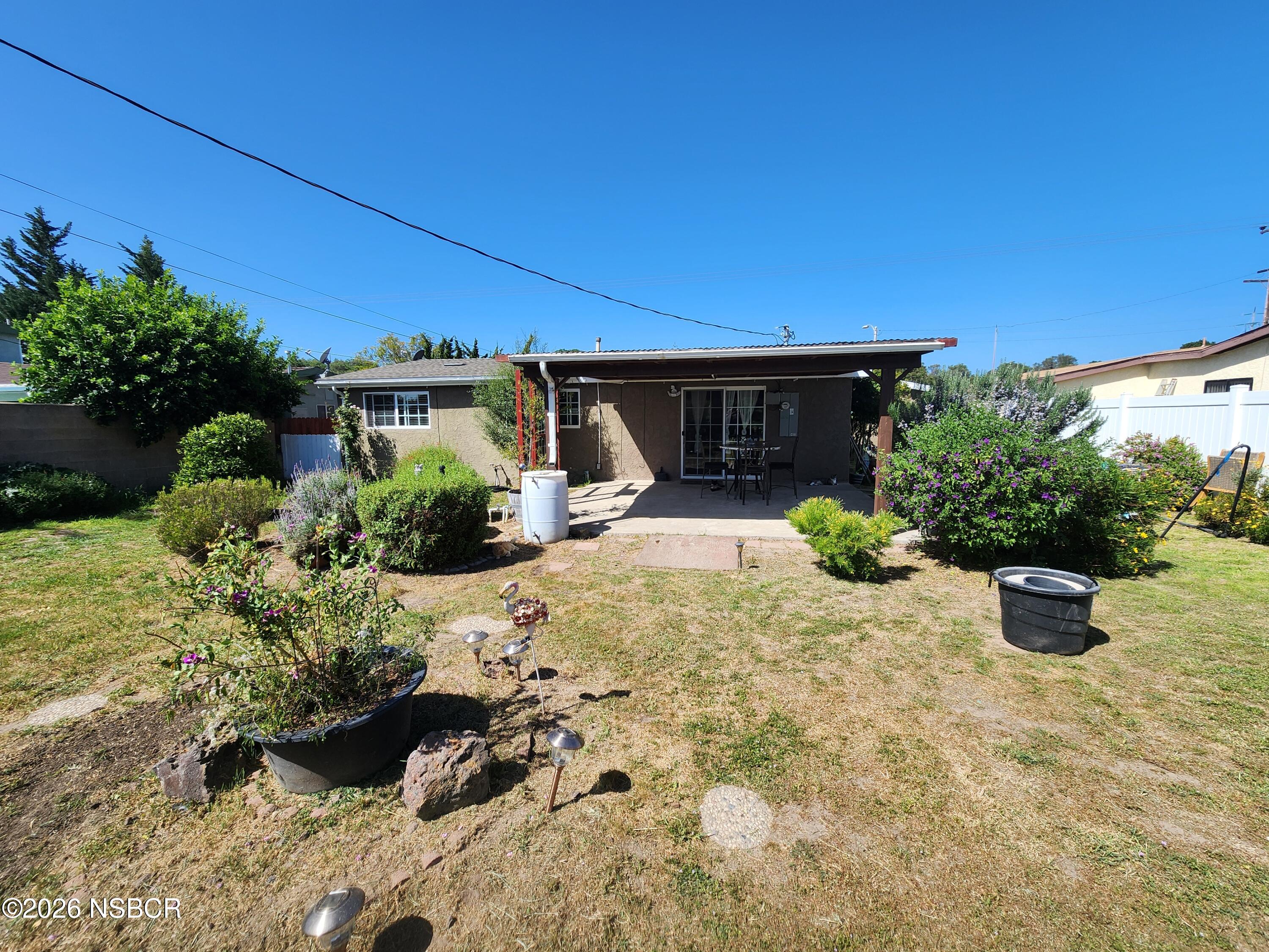 3770 Rucker Road Lompoc, CA 93436 - Photo 25 of 36 a view of a backyard with plants and patio