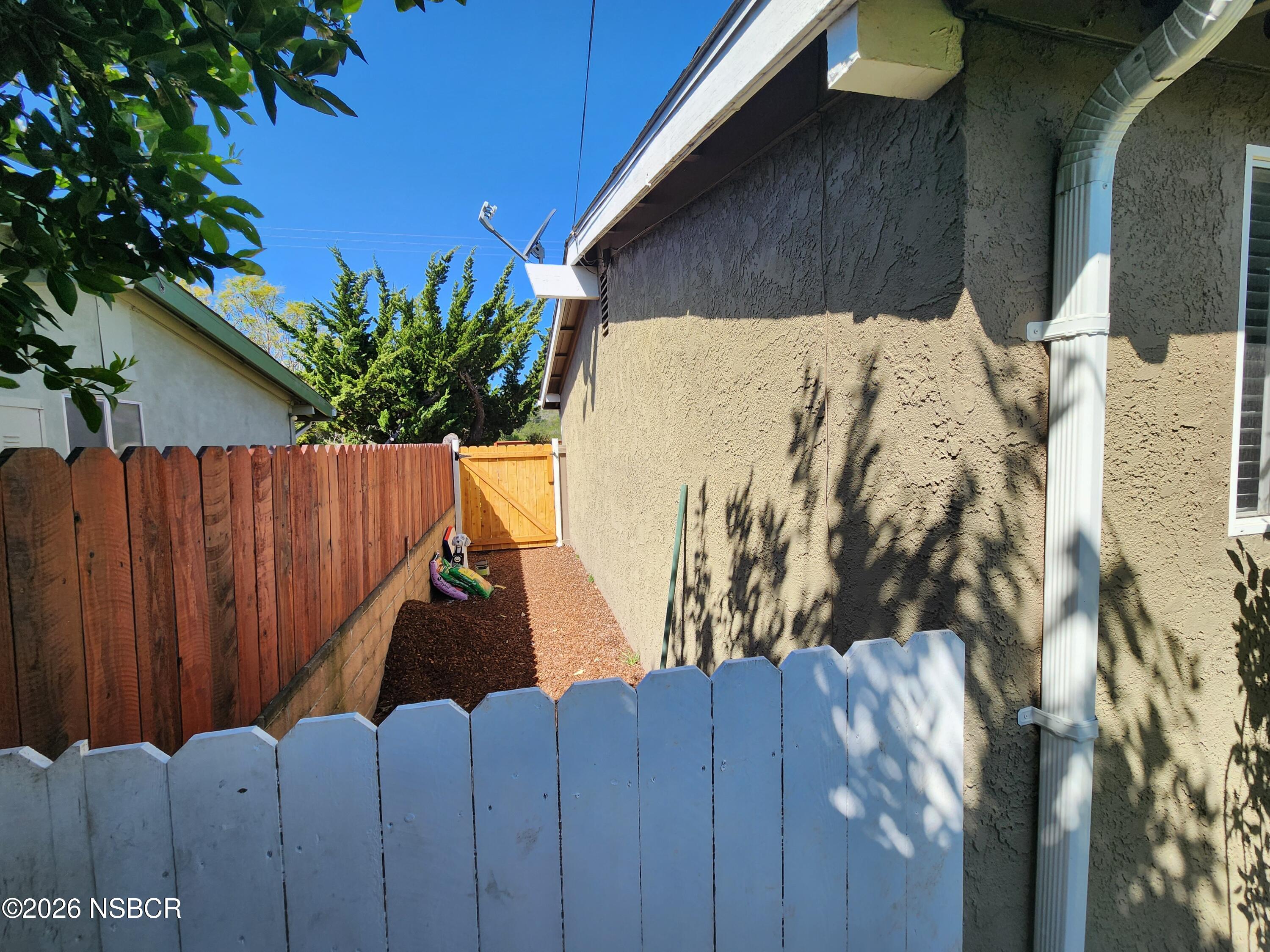 3770 Rucker Road Lompoc, CA 93436 - Photo 34 of 36 a view of a house with a backyard