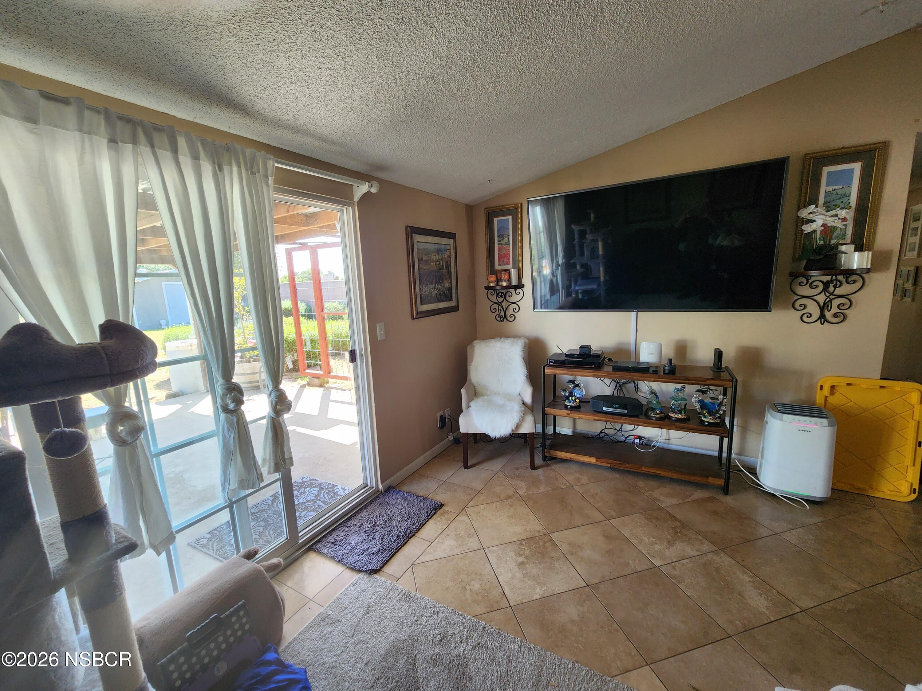 3770 Rucker Road Lompoc, CA 93436 - Photo 5 of 36 a living room with furniture and a flat screen tv