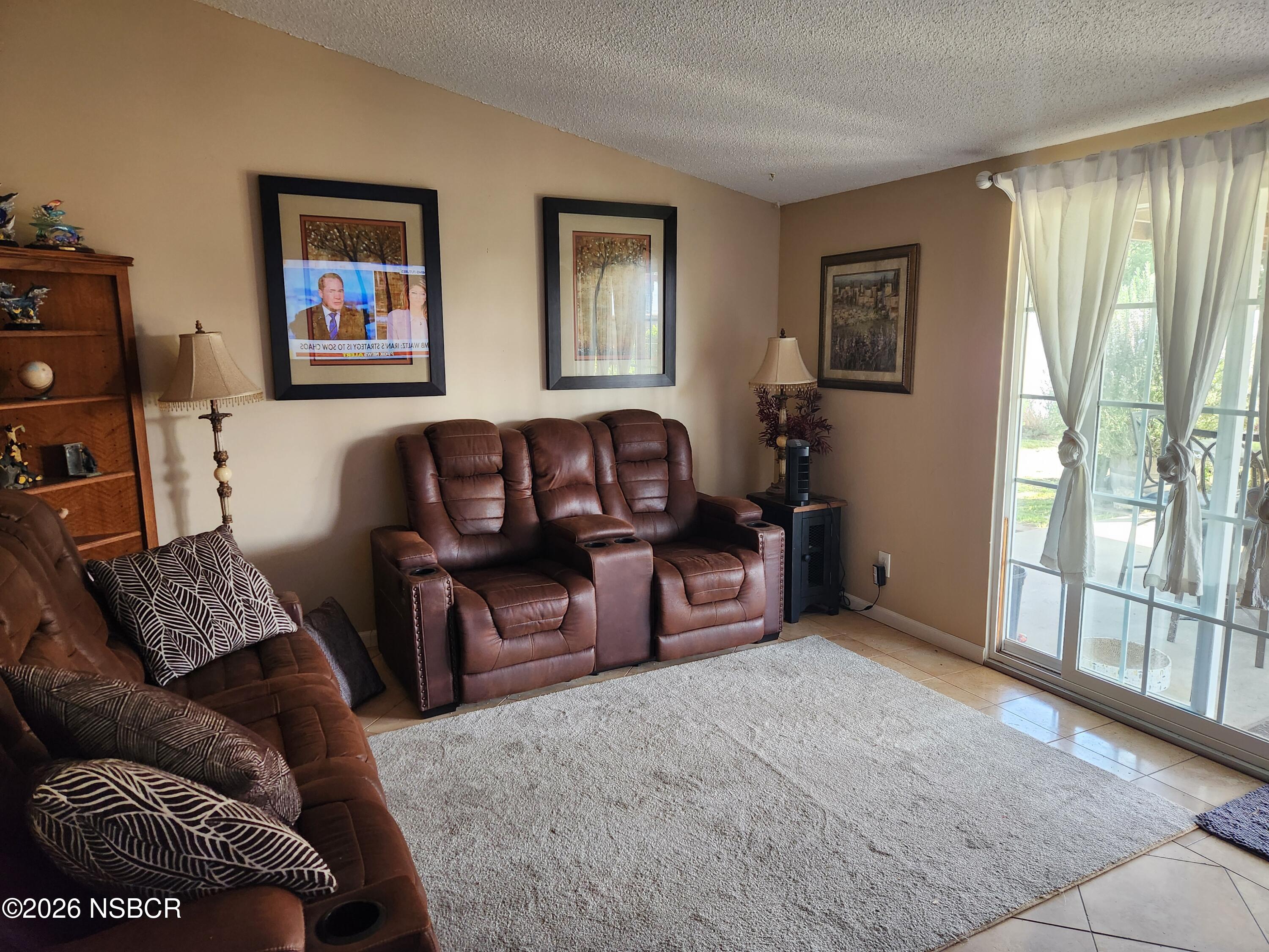 3770 Rucker Road Lompoc, CA 93436 - Photo 7 of 36 a living room with furniture and a window