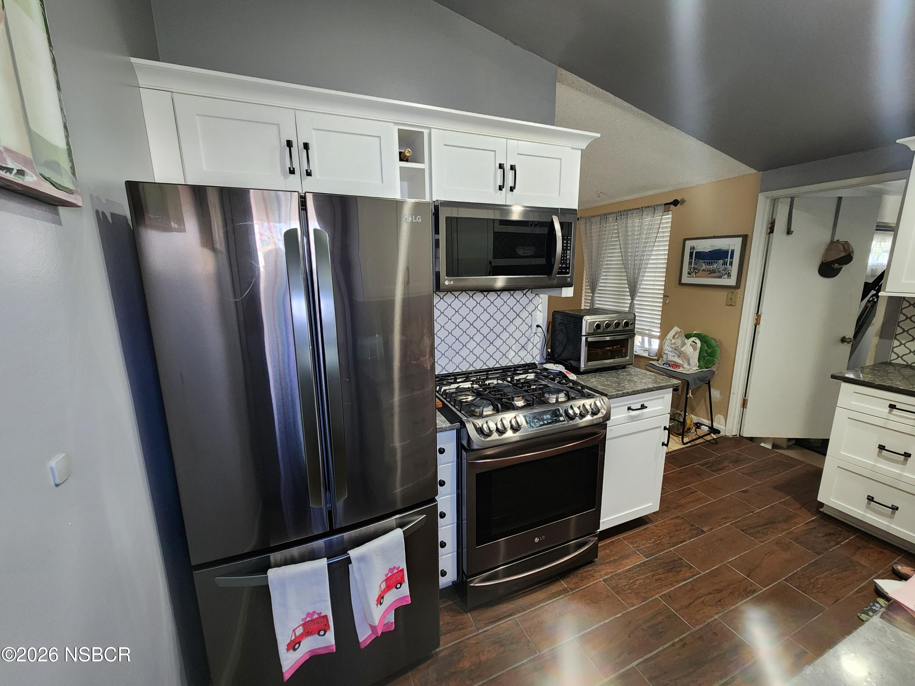 3770 Rucker Road Lompoc, CA 93436 - Photo 9 of 36 a kitchen with stainless steel appliances a refrigerator stove and sink