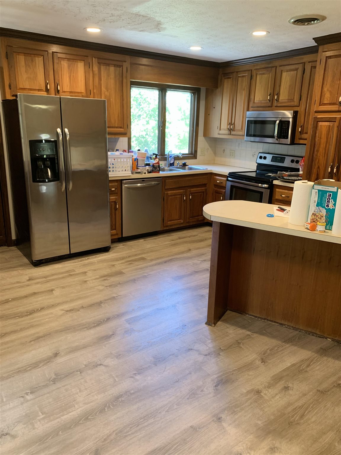 197 Kindig Road Waynesboro, VA 22980 - Photo 7 of 17 a kitchen with stainless steel appliances granite countertop a refrigerator a sink a stove a microwave and wooden floors