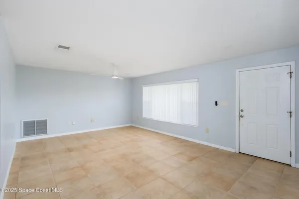 a kitchen with stainless steel appliances granite countertop a refrigerator a sink and a stove